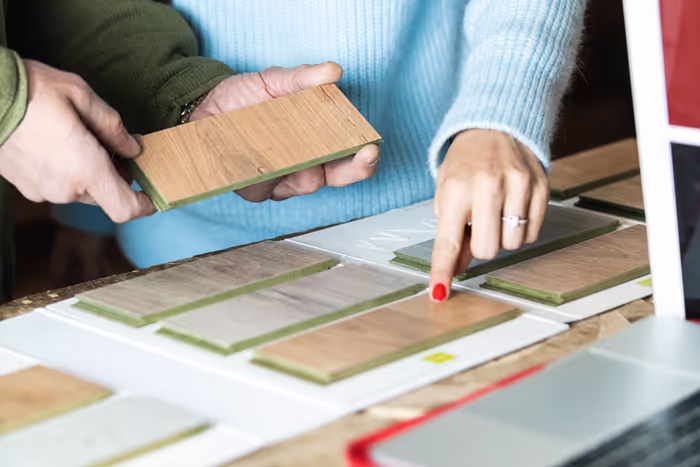 person picking out type of flooring